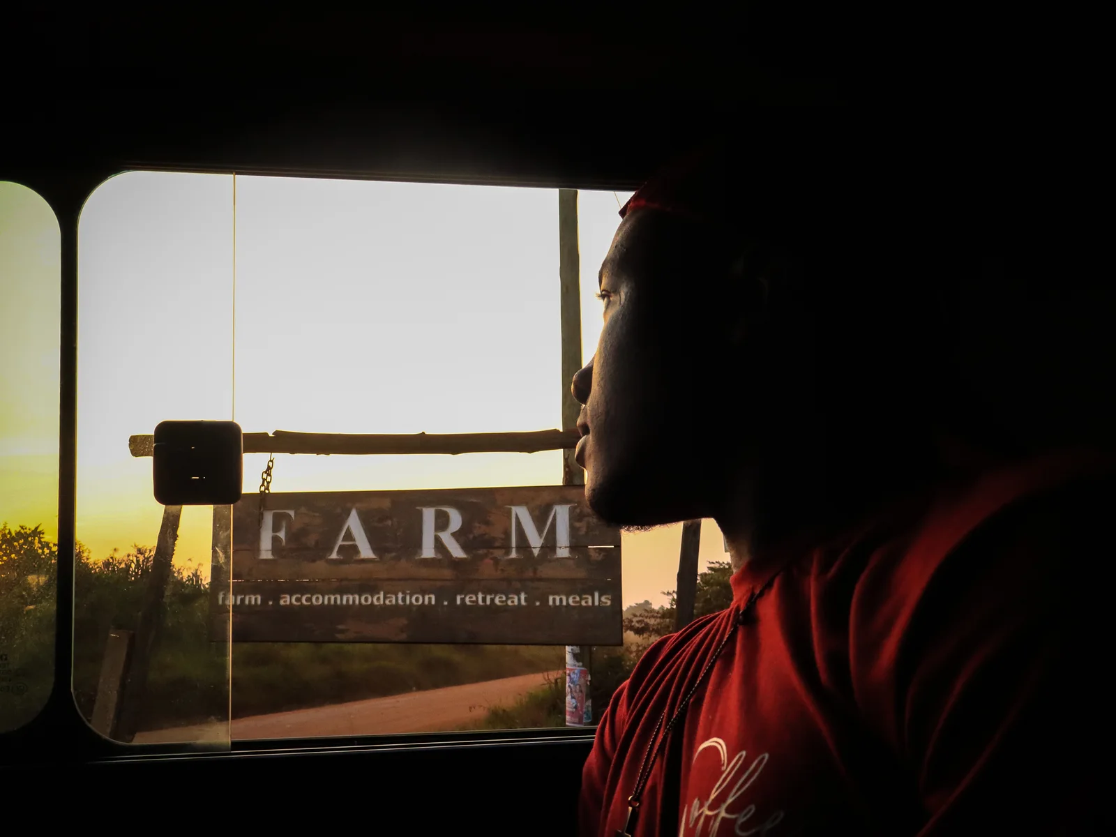 Arriving at the farm gate as the sun sets over the coffee fields